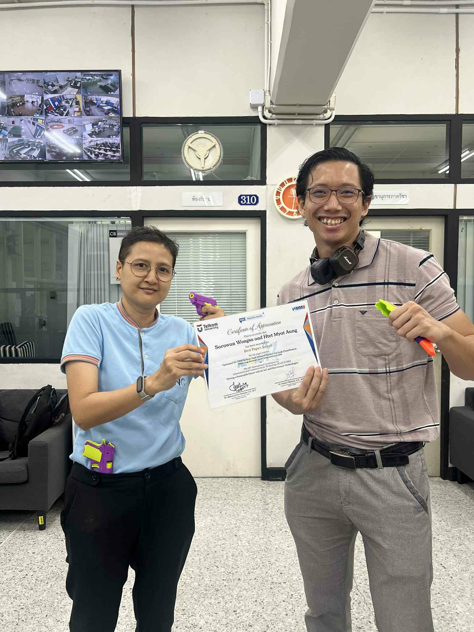 Htet Myat Aung receiving the Best Paper Award at IEEE ICoICT 2025 with Asst. Prof. Dr. Sarawan Wongsa