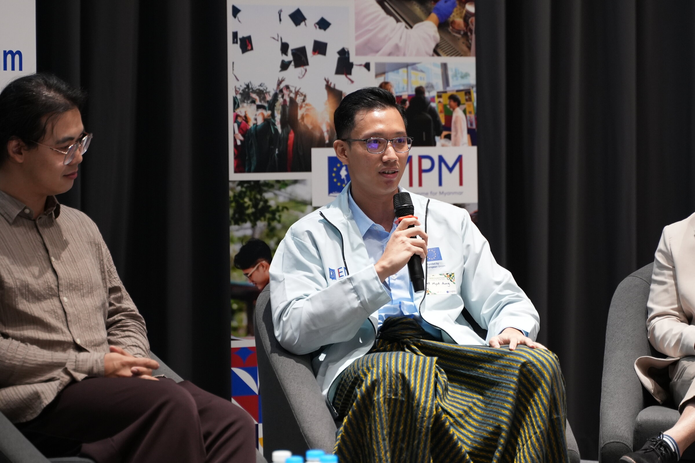 Answering a question on the fireside talk panel at the EMPM Student Forum