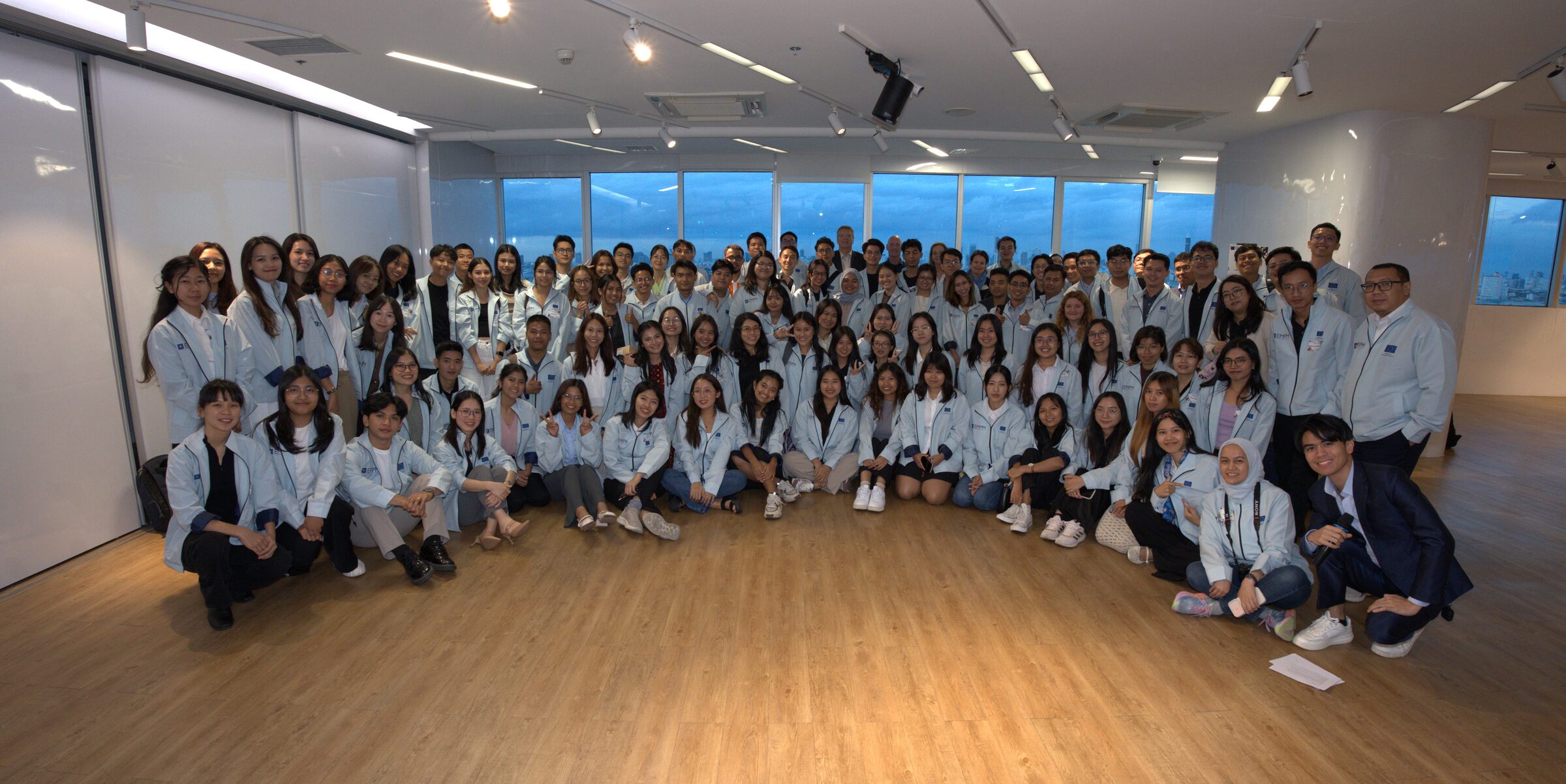 Group photograph of EMPM scholarship students and alumni at the forum in Bangkok