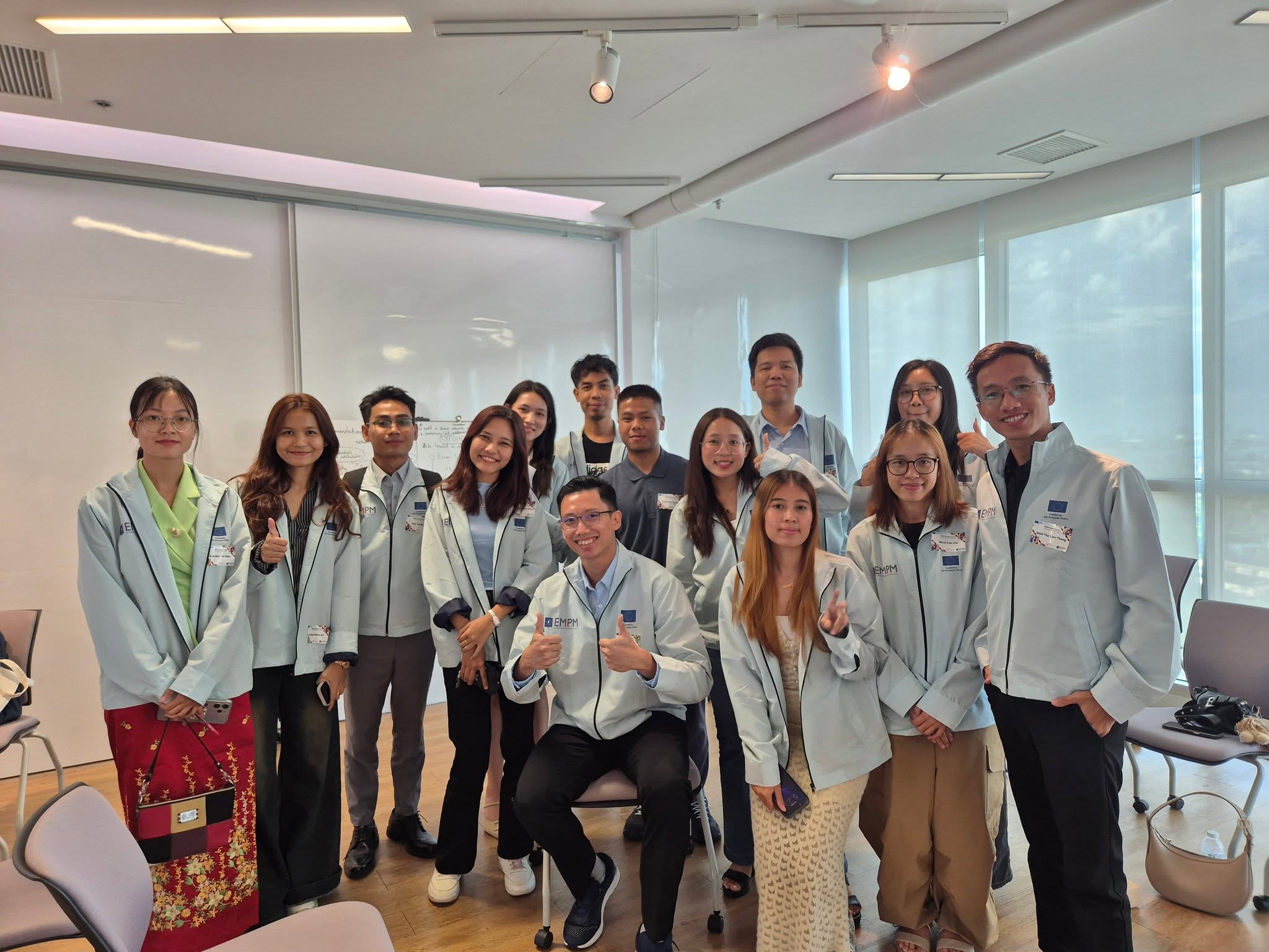 Htet Myat Aung with fellow EMPM students after the fireside talk session